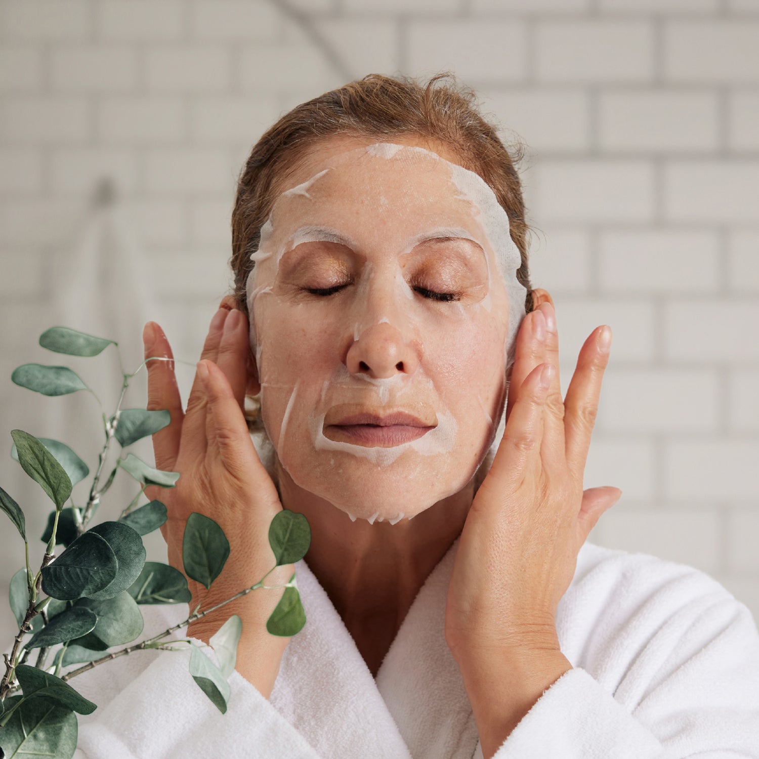 woman wearing hydra sheet mask skin formulas